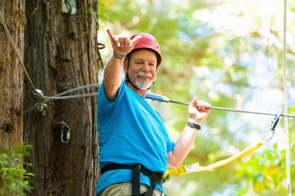 smiling man doing challenge course