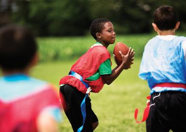 Kids playing football