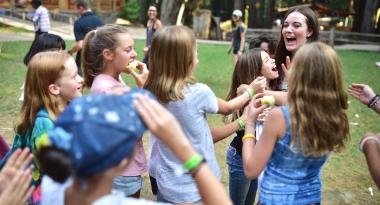 excited campers gather together