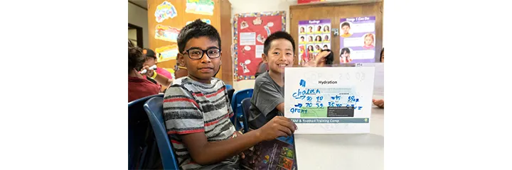 Youth learning about adequate water intake