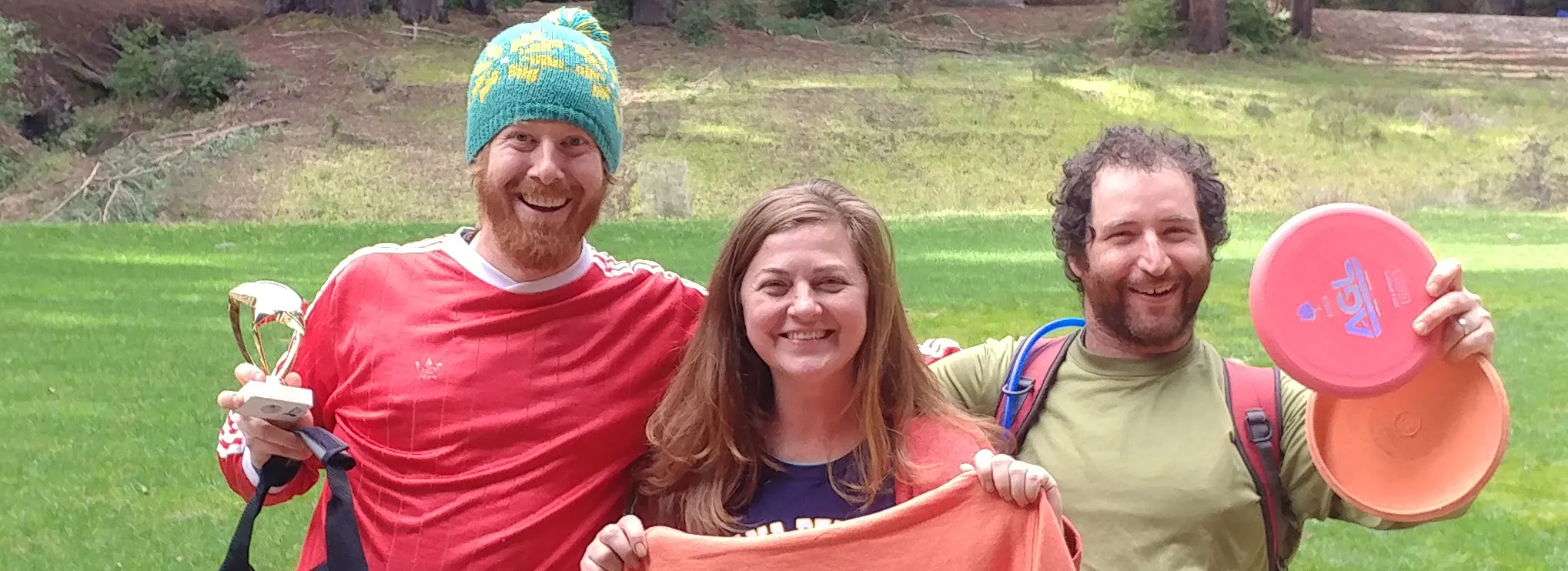 Excited people holding up prizes