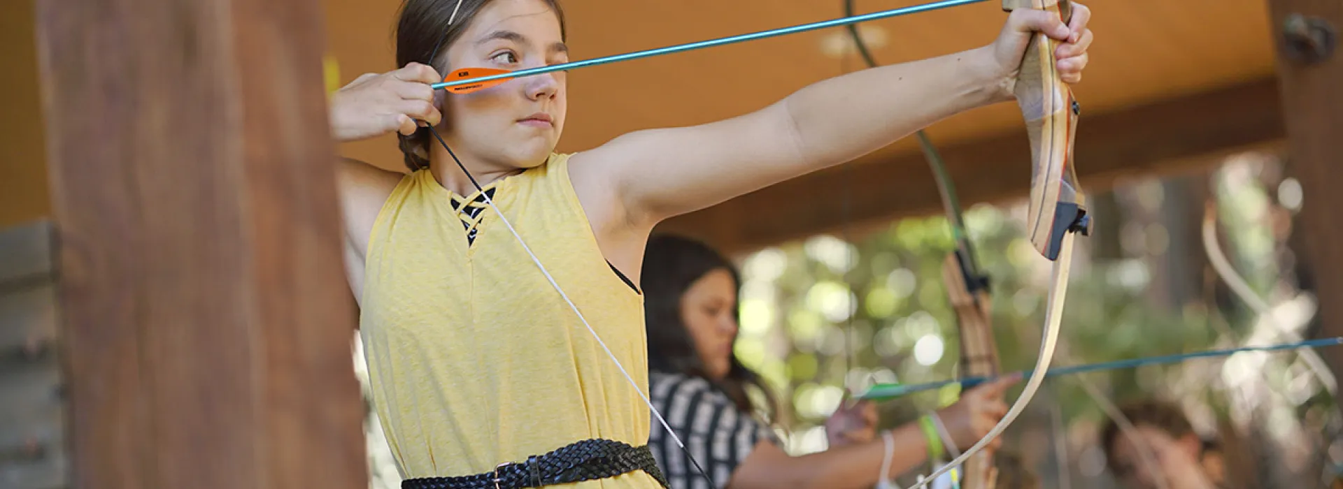 Camper learning archery