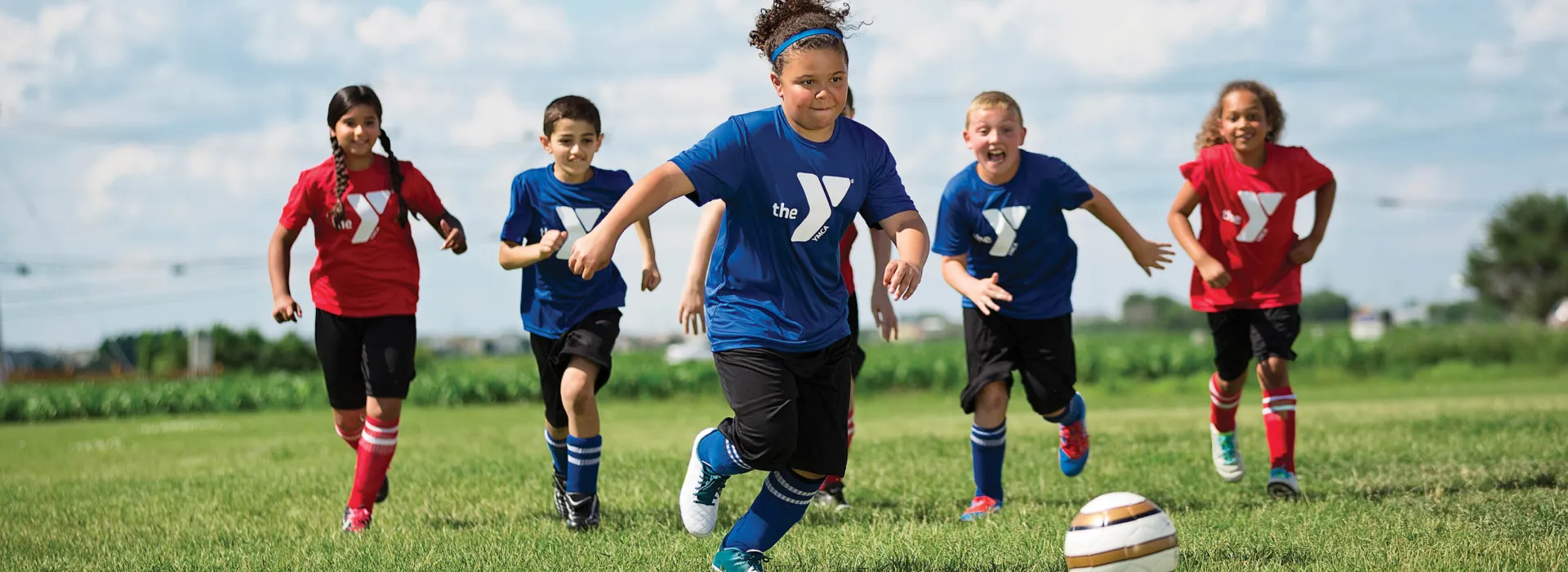 Youth playing soccer outside